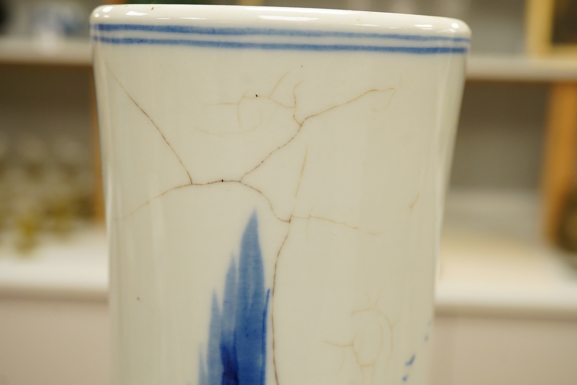 A Chinese blue and white bottle vase decorated with a landscape, 47cm high. Condition - poor